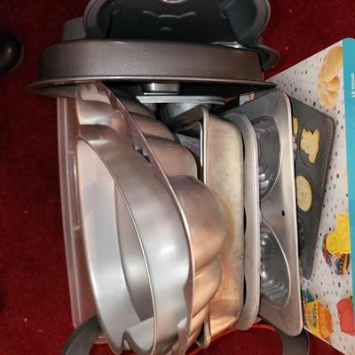 Lot of baking pans. Many shapes. About 15. Total.