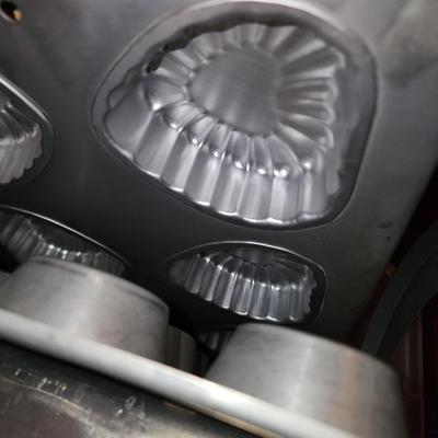 Lot of baking pans. Many shapes. About 15. Total.