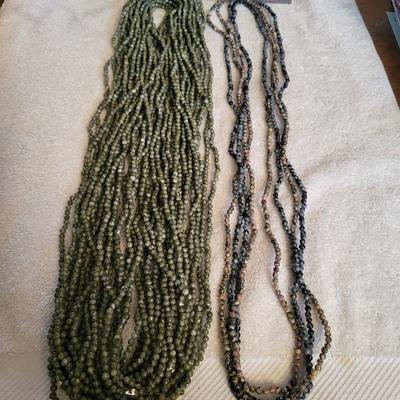 22 STRAND NECKLACE OF GREEN JASPER AND 4 STRAND NECKLACE OF MULTI COLOR BEADS