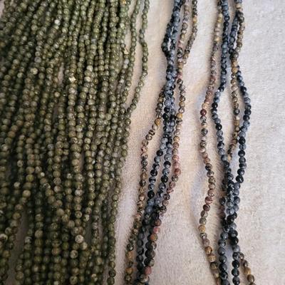 22 STRAND NECKLACE OF GREEN JASPER AND 4 STRAND NECKLACE OF MULTI COLOR BEADS