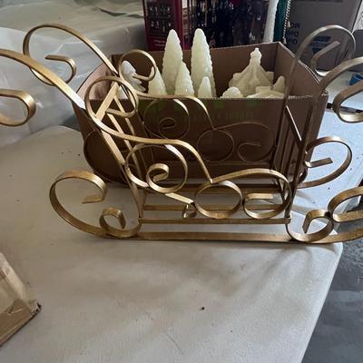Box of Christmas decor and sleigh