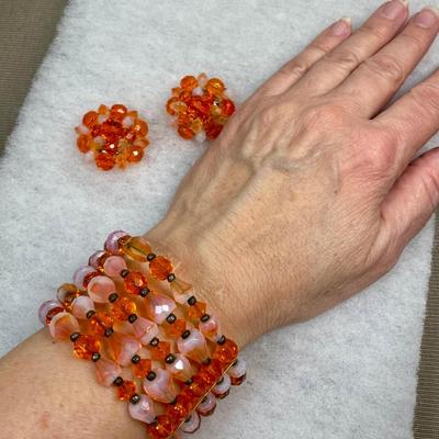 Signed faceted glass beaded bracelet and earrings