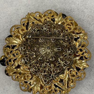 Unusual art and foil glass beaded pin