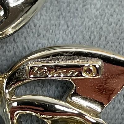 Signed wide gold tone and pink metal bracelet