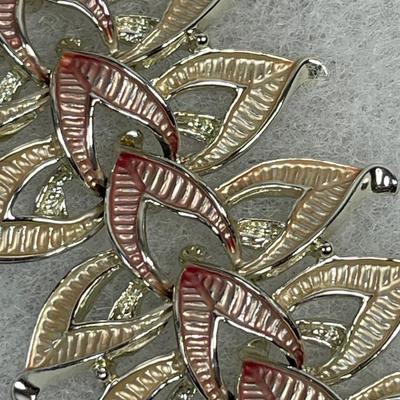 Signed wide gold tone and pink metal bracelet