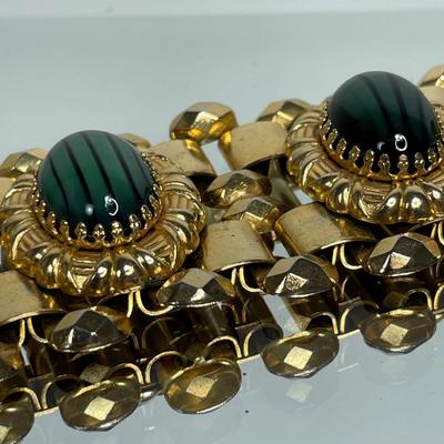 Wide bracelet with green glass cabochons