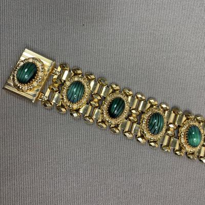 Wide bracelet with green glass cabochons