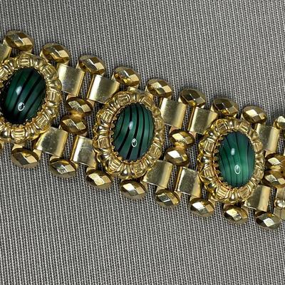 Wide bracelet with green glass cabochons