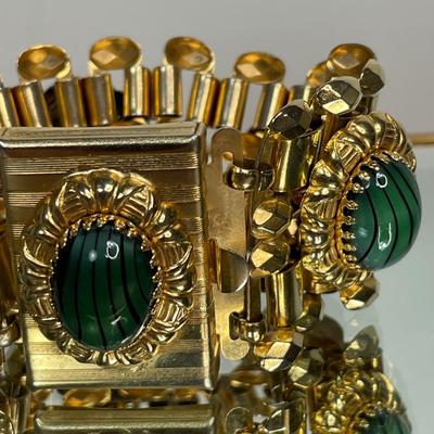 Wide bracelet with green glass cabochons