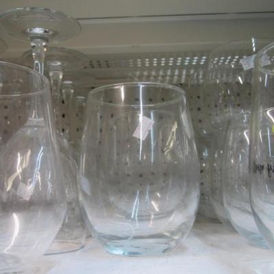 Assortment Of Clear Glass Drinking Glasses Some Etched