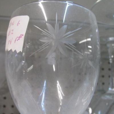 Assortment Of Clear Glass Drinking Glasses Some Etched
