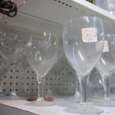 Assortment Of Clear Glass Drinking Glasses Some Etched