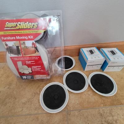 Lot of 2 wifi range extenders and a box plus of furniture moving sliders