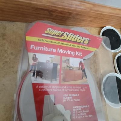 Lot of 2 wifi range extenders and a box plus of furniture moving sliders