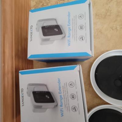 Lot of 2 wifi range extenders and a box plus of furniture moving sliders