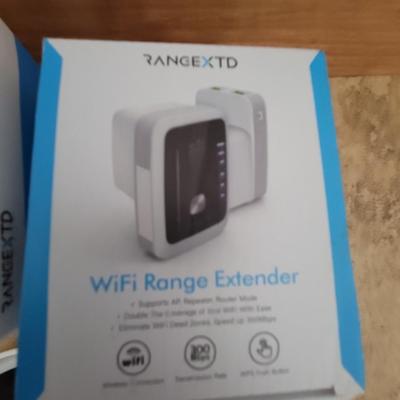 Lot of 2 wifi range extenders and a box plus of furniture moving sliders