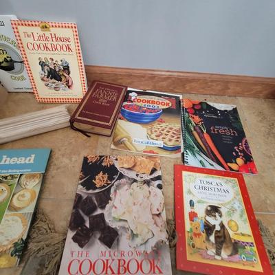 Lot of cookbooks and kitchen/camping items
