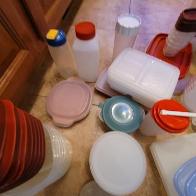 Lot of containers and measuring bowls and wooden bols serving bowl