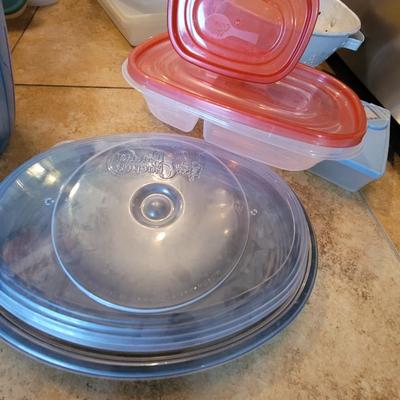 Lot of containers and measuring bowls and wooden bols serving bowl