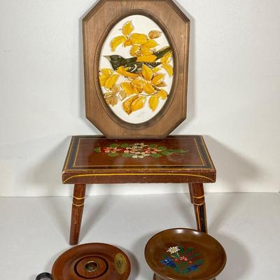 LOT 74: Collection of Hand Crafted Wood Decor - 3D Bird Wall Hanging, Cuendet Rotating Swiss Musical Bowl, Painted Stool, Carved Wall...