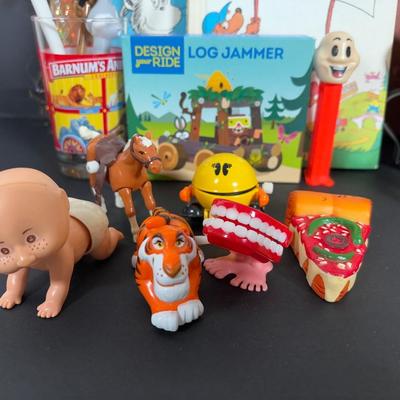 LOT 90: Dr. Suess Books, Wind-up Walking Toys. Simpsons Pez Dispensers, Fisher Price Medical Kit & More
