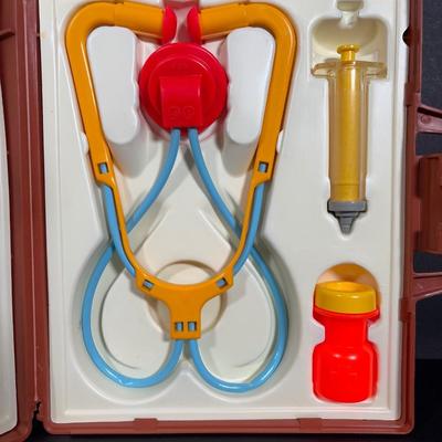 LOT 90: Dr. Suess Books, Wind-up Walking Toys. Simpsons Pez Dispensers, Fisher Price Medical Kit & More