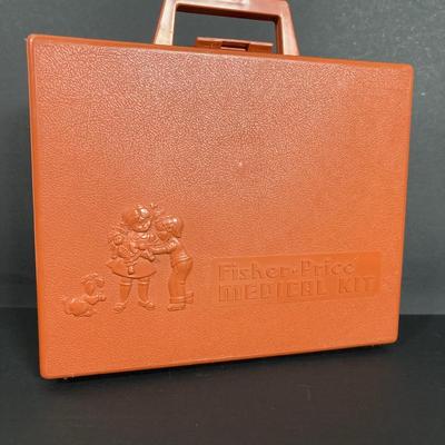 LOT 90: Dr. Suess Books, Wind-up Walking Toys. Simpsons Pez Dispensers, Fisher Price Medical Kit & More