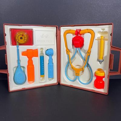 LOT 90: Dr. Suess Books, Wind-up Walking Toys. Simpsons Pez Dispensers, Fisher Price Medical Kit & More