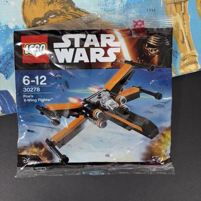 LOT 106: Vintage Star Wars Twin Sheet Set, Unopened Mini Star Wars Poe's X-Wing Fighter Legos, Star Wars Pez Dispenser &...