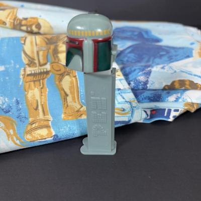 LOT 106: Vintage Star Wars Twin Sheet Set, Unopened Mini Star Wars Poe's X-Wing Fighter Legos, Star Wars Pez Dispenser &...