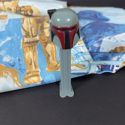 LOT 106: Vintage Star Wars Twin Sheet Set, Unopened Mini Star Wars Poe's X-Wing Fighter Legos, Star Wars Pez Dispenser &...