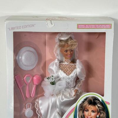 LOT 150: I Love Lucy, Sabrina The Teenage Witch, Vanna White Dolls in Package