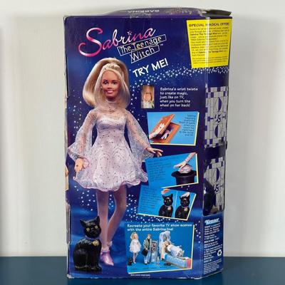 LOT 150: I Love Lucy, Sabrina The Teenage Witch, Vanna White Dolls in Package