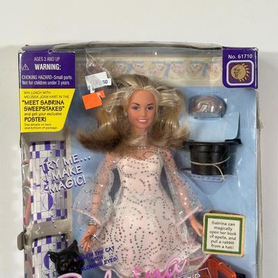 LOT 150: I Love Lucy, Sabrina The Teenage Witch, Vanna White Dolls in Package