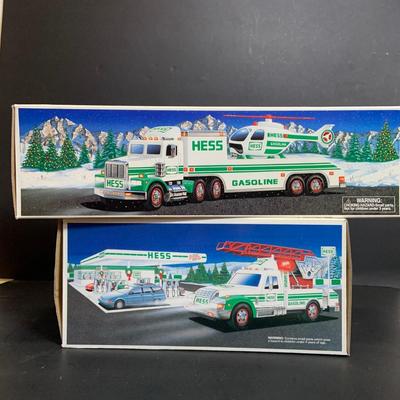 LOT:166: Collection of 5 Hess Trucks - 1994 Rescue Truck, 1995 Truck with Helicopter, 1996 Emergency Truck, 1997 Truck with Racer and...