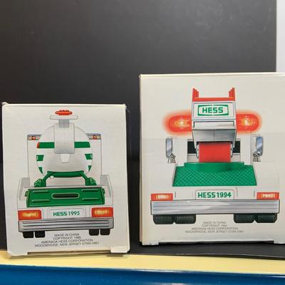 LOT:166: Collection of 5 Hess Trucks - 1994 Rescue Truck, 1995 Truck with Helicopter, 1996 Emergency Truck, 1997 Truck with Racer and...