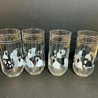 LOT:174: Cats in the Kitchen a Fun Collection of Cat Themed Cookie Jar, Glasses, Mugs, Salt and Pepper Shakers, Creamer and More