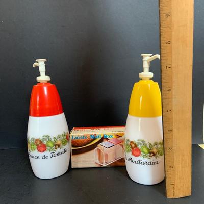 LOT:175: The Mid-century Kitchen Must Haves, Including Tupperware Lidded Mugs and Salt and Pepper Shakers a Microwave Steamer, Fire King...