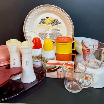 LOT:175: The Mid-century Kitchen Must Haves, Including Tupperware Lidded Mugs and Salt and Pepper Shakers a Microwave Steamer, Fire King...