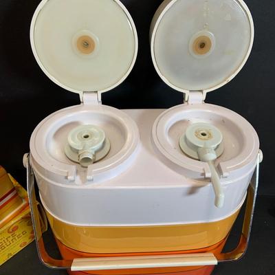 LOT:180: Mid-Century Orange Kitchen Including a Peacock Hot/Cold Twin Air Pot Vacuum Thermos, 70' Style Drinking Glasses and Napkin...