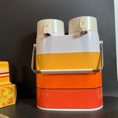 LOT:180: Mid-Century Orange Kitchen Including a Peacock Hot/Cold Twin Air Pot Vacuum Thermos, 70' Style Drinking Glasses and Napkin...