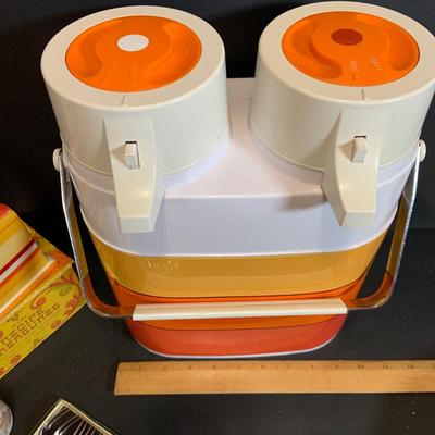 LOT:180: Mid-Century Orange Kitchen Including a Peacock Hot/Cold Twin Air Pot Vacuum Thermos, 70' Style Drinking Glasses and Napkin...