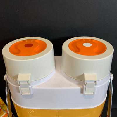 LOT:180: Mid-Century Orange Kitchen Including a Peacock Hot/Cold Twin Air Pot Vacuum Thermos, 70' Style Drinking Glasses and Napkin...