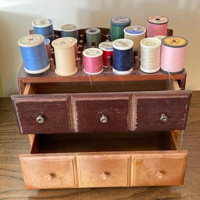 LOT 222: Sewing Collection - Fabric (Vintage / Novelty and More), Storage Containers, Spool Holders and Sewing Guide Book