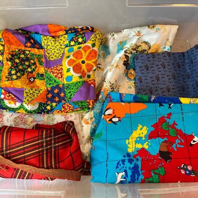 LOT 222: Sewing Collection - Fabric (Vintage / Novelty and More), Storage Containers, Spool Holders and Sewing Guide Book