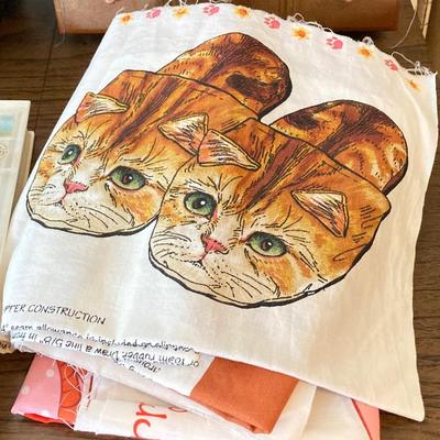 LOT 222: Sewing Collection - Fabric (Vintage / Novelty and More), Storage Containers, Spool Holders and Sewing Guide Book