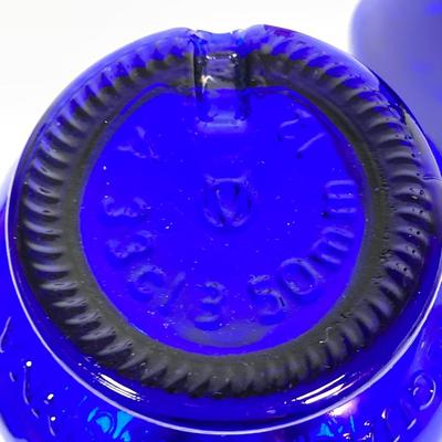 LOT 234: Decorative Collection - Cobalt Blue Bottles (Italy Acqua della Madonna), Calla Lily Candle Holders, Glass Coasters and More