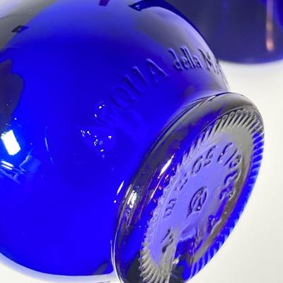 LOT 234: Decorative Collection - Cobalt Blue Bottles (Italy Acqua della Madonna), Calla Lily Candle Holders, Glass Coasters and More