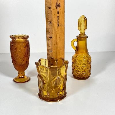 LOT 236: Amber Glass Collection - Candlestick Holders, MCM Ngori Italy Glass Grapes Salt & Pepper Shakers, Round Cut Glass Serving...