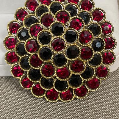 Lisner red and black rhinestone brooch